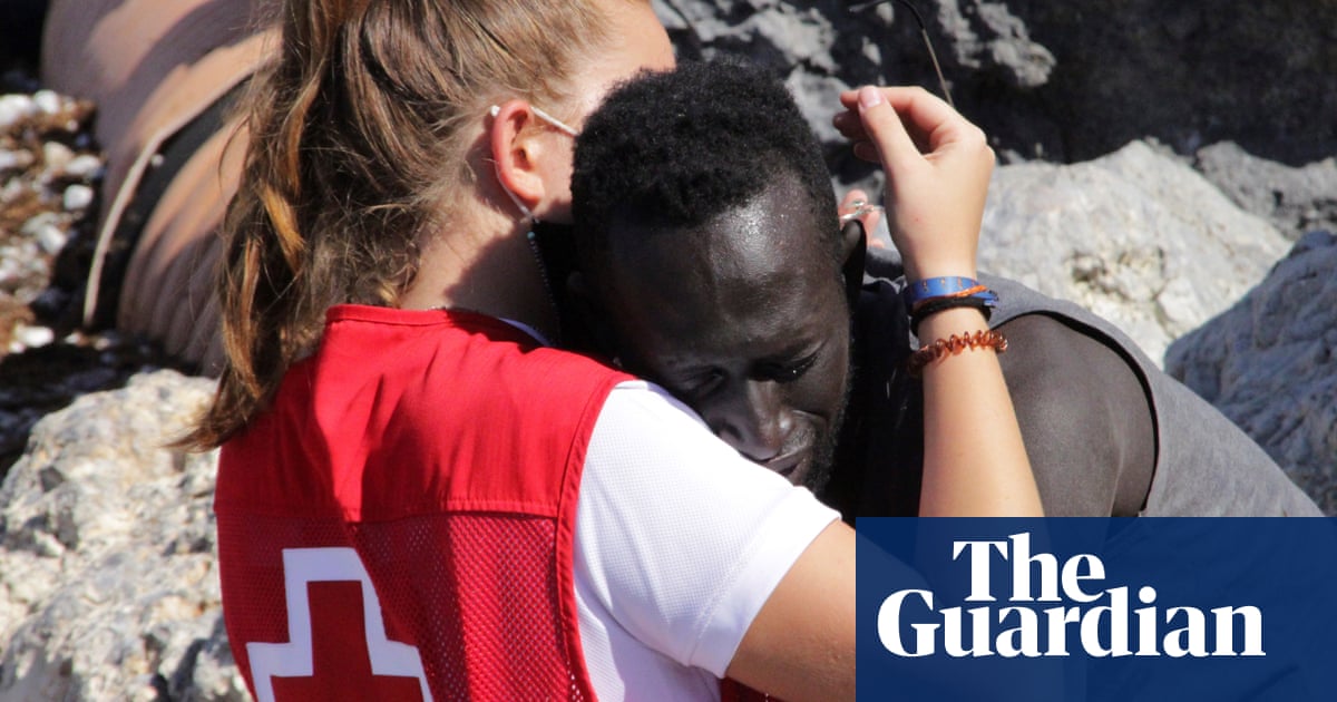 Spanish aid volunteer abused online for hugging African migrant