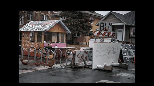 Unidentified Man Desecrates George Floyd Memorial With An Ax • EBONY